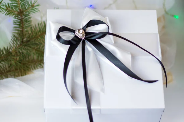 Christmas Gift Decorated Beautiful Bow Light Background Fir Twig Gifts — 图库照片
