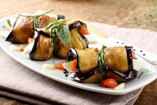 Eggplant rolls with cheese, tomato and basil — Stock Photo, Image