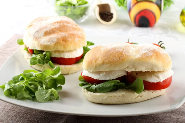 Sandwiches with mozzarella, tomato and lettuce — Stock Photo, Image