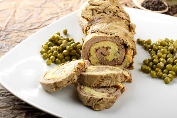 Rolled meat stuffed with omelette — Stock Photo, Image