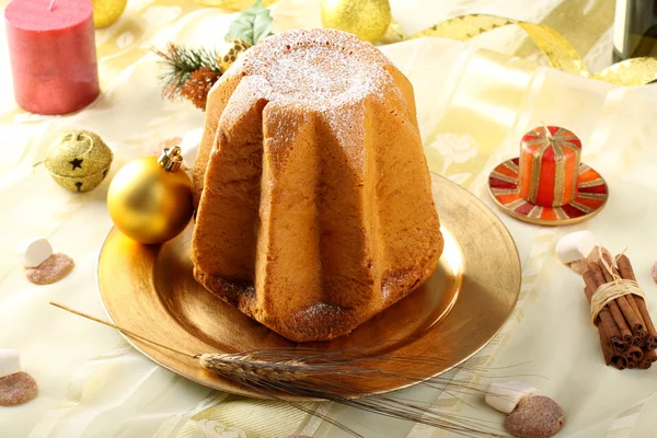 Pandoro Christmas cake on decorated table — Stock Photo, Image