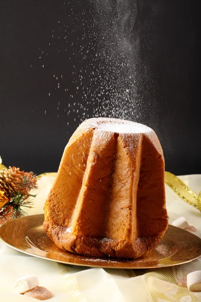 Pandoro Christmas cake on decorated table — Stock Photo, Image