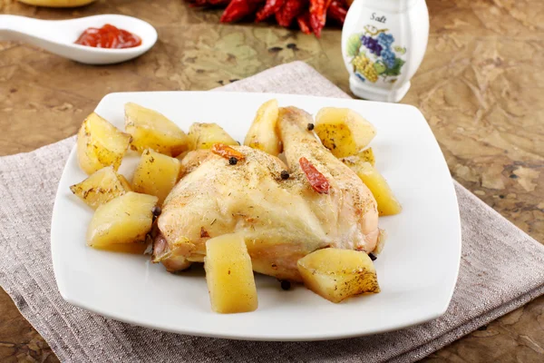 Chicken leg baked with potatoes — Stock Photo, Image
