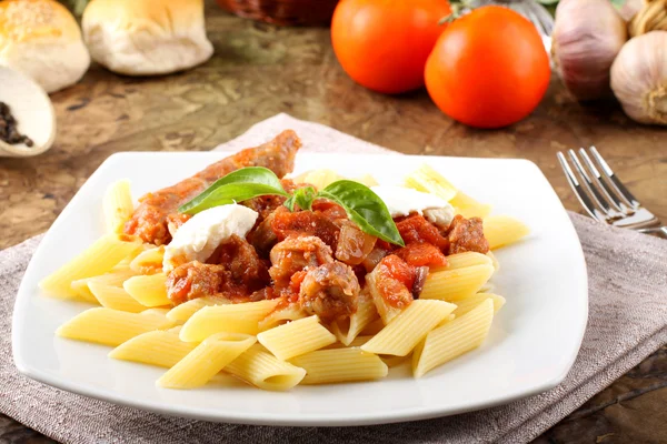 Pasta with tomato, sausage and ricotta — Stock Photo, Image