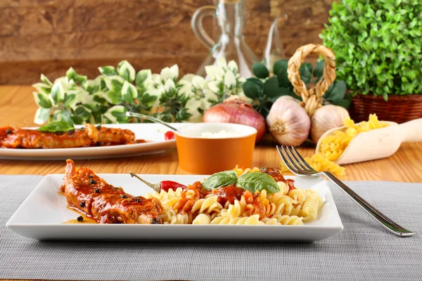 Fusilli pasta with pork and tomato sauce — Stock Photo, Image
