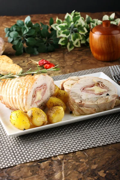 Roulade of stuffed chicken with potatoes and rosemary — Stock Photo, Image