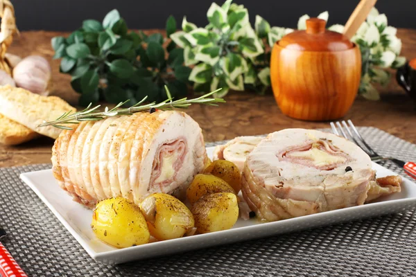 Roulade of stuffed chicken with potatoes and rosemary — Stock Photo, Image