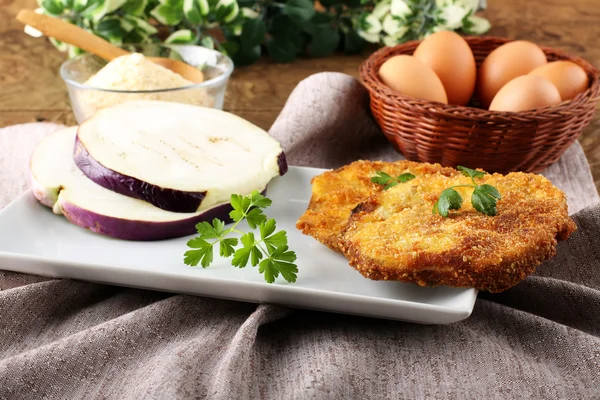 Eggplant cutlet with beaten egg and breadcrumbs — Stock Photo, Image