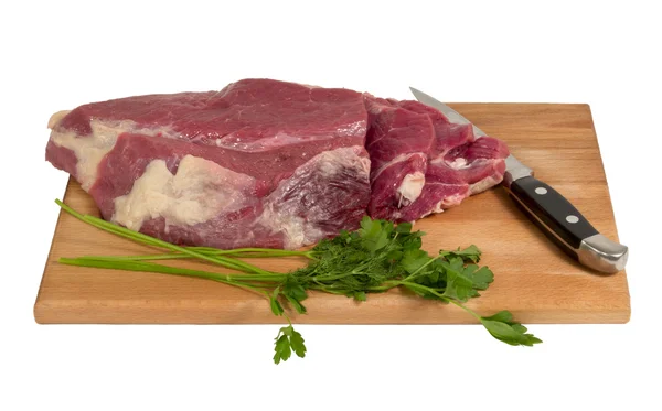 Raw meat on a cutting board — Stock Photo, Image