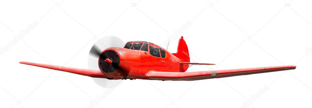Front side view of red aerobatic sports aircraft with piston engine with rotating propeller. Isolated on white background 
