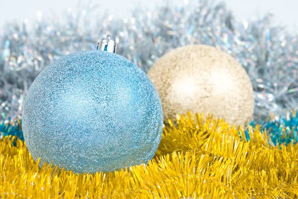 Christmas background with a blue and gold balls