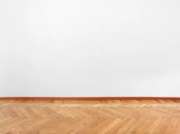 Parquet, wooden floor, and empty white wall — Stock Photo, Image