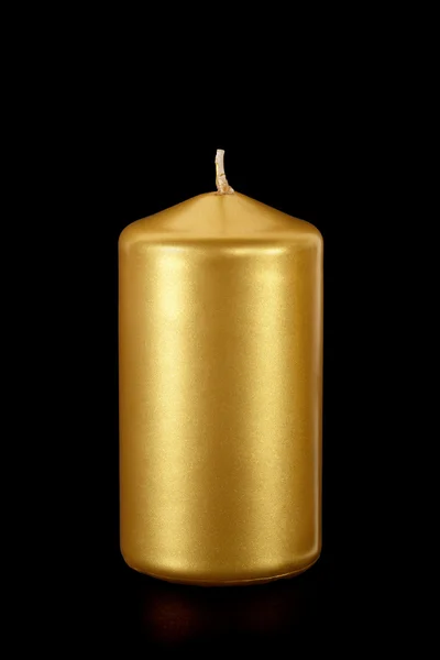 Golden candle on black — Stock Photo, Image