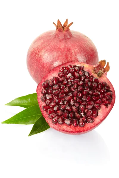 Pomegranate and half with leaves — Stock Photo, Image