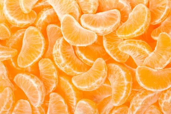 Mandarinkový segmenty, oranžové pozadí — Stockfoto