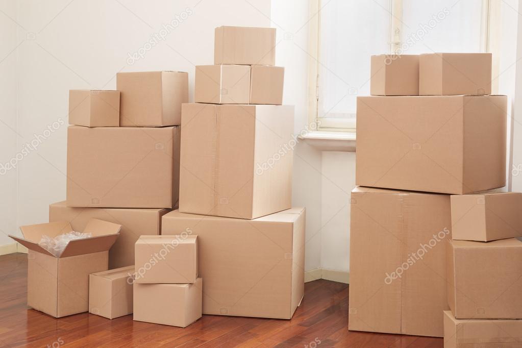 Cardboard boxes in interior, moving day — Stock Photo © AndreaA. 25245285