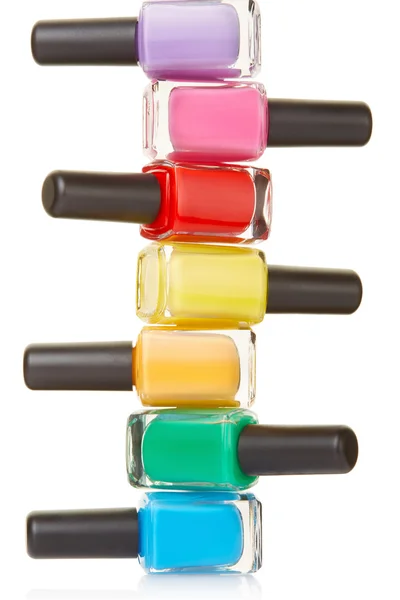 Nail polish bottles colorful stack — Stock Image Nail polish bottles colorful stack Stock Photo