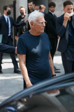 MILAN, ITALY - JUNE 18, 2022: Giorgio Armani after Emporio Armani fashion show, Milan Fashion Week street style