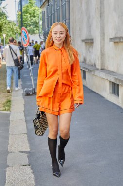 MILAN, ITALY - JUNE 19, 2022: Niki Wu Jie before Prada fashion show, Milan Fashion Week street style