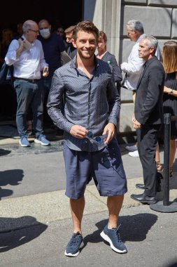 MILAN, ITALY - JUNE 20, 2022: Jonathan Bailey before Giorgio Armani fashion show, Milan Fashion Week street style clipart