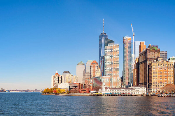 Lower Manhattan, New York, NY, USA - November 21, 2015: view from Hudson river of the Financial District, one of the most affluent neighborhoods with towering skyscrapers and famous historic buildings