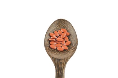 tahta kaşık kırmızı hapları