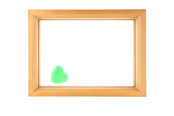 Houten frame en groene hart — Stockfoto