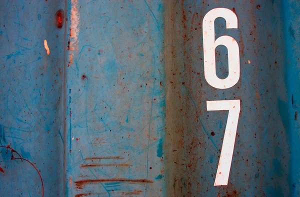Numeric on grunge blue steel texture — Stock Photo, Image