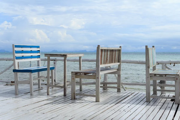 Wooden vintage table set and sea background — Stock Photo, Image