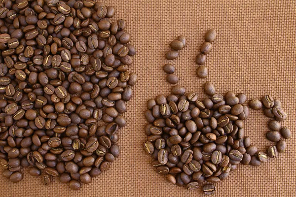 Kávová zrna na pozadí Dřevěná deska grung — Stock fotografie