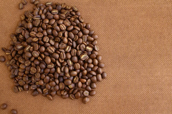 Granos de café sobre fondo grung tablero de madera — Foto de Stock