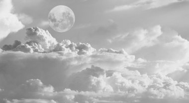 Dramatic moon over white cloud clipart