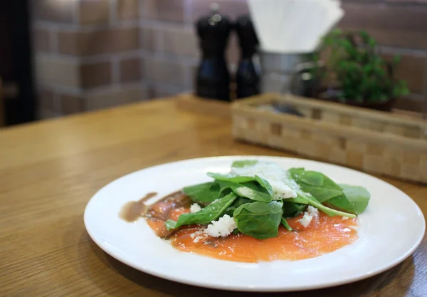 Fresh rocket green salad with salted salmon, selective focus — Stock Photo, Image