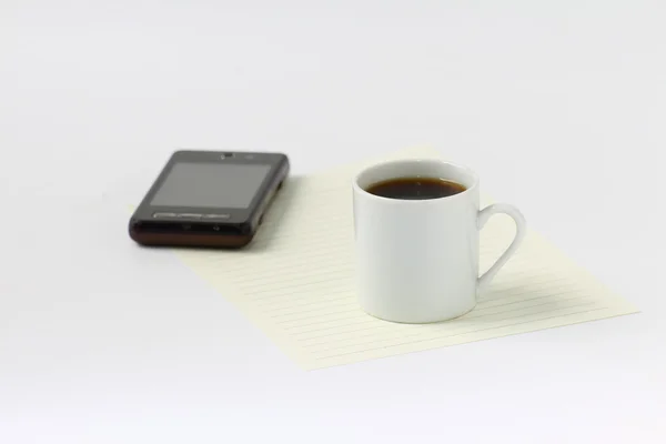 Prázdný papír, šálek kávy a mobilní — Stock fotografie