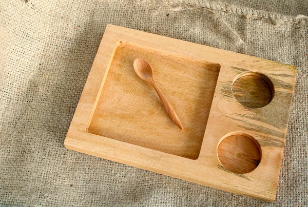 Wooden tray and spoon — Stock fotografie