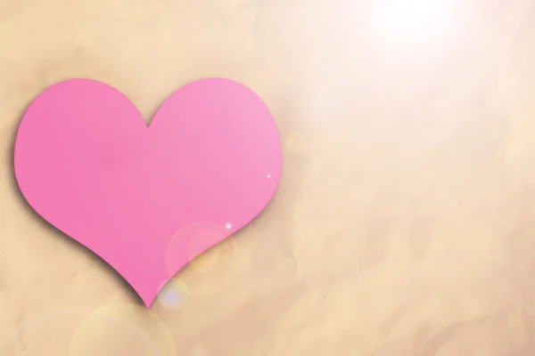 Pink heart on crumpled paper — Stock Photo, Image