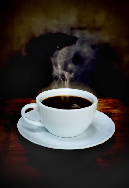 Xícara de café na mesa de madeira velha — Fotografia de Stock