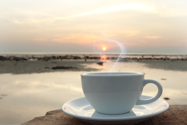 Coffee cup in the morning on terrace facing seascape 