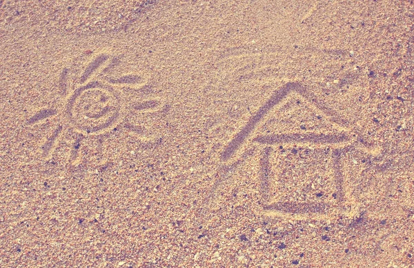 Happy sun drawn on sand — Stock Photo, Image