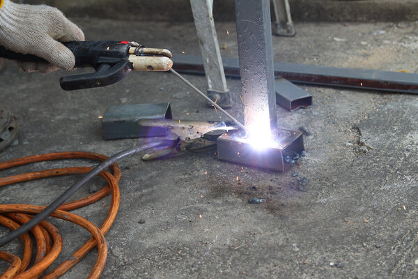 Man hand iron welding