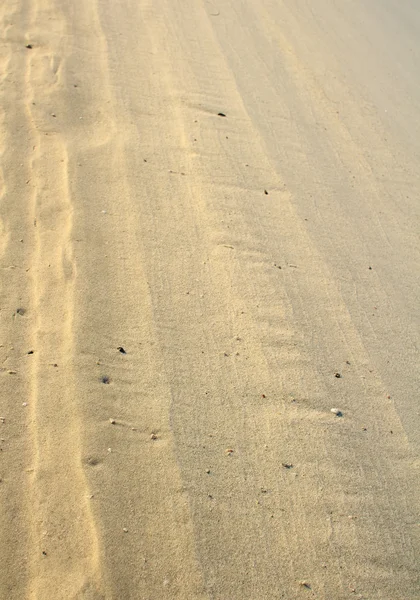 Areia de praia texturizado útil para fundo — Fotografia de Stock