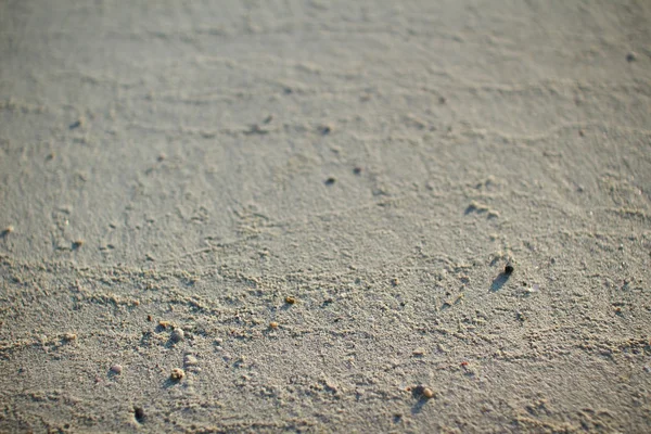 Strand zand getextureerde nuttig voor achtergrond — Stockfoto