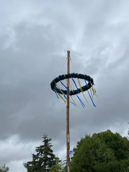 typical maypole in bavaria with the bavarian coat of arms - germany. May Pole