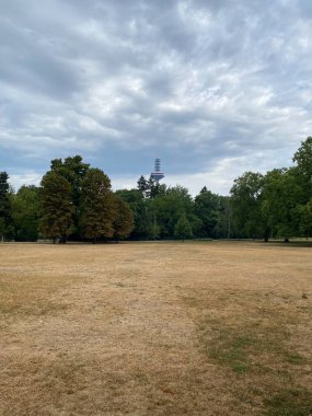 FRANKFURT AM MAIN, GERMANY: Path in a Park on a Summer day. Grneburgpark, memorial stele with television tower