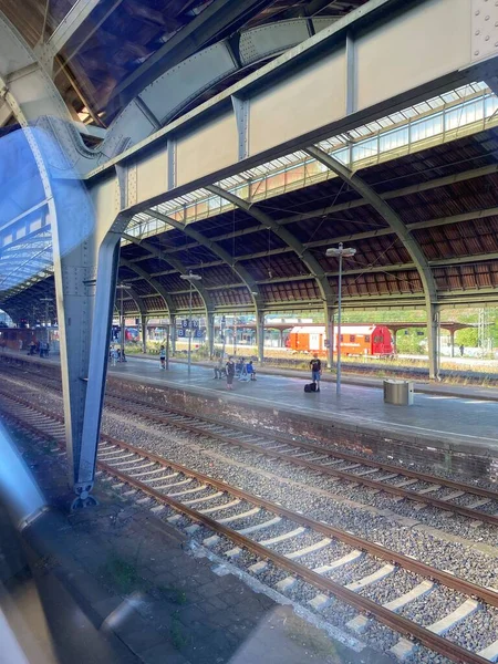 View of the railroad at the station in the morning. Modern passenger train at the platform of the main railway station