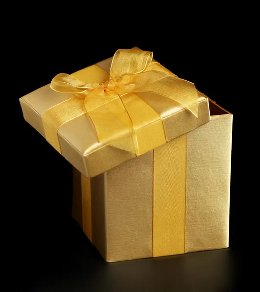 Golden present slightly open — Stock Photo, Image