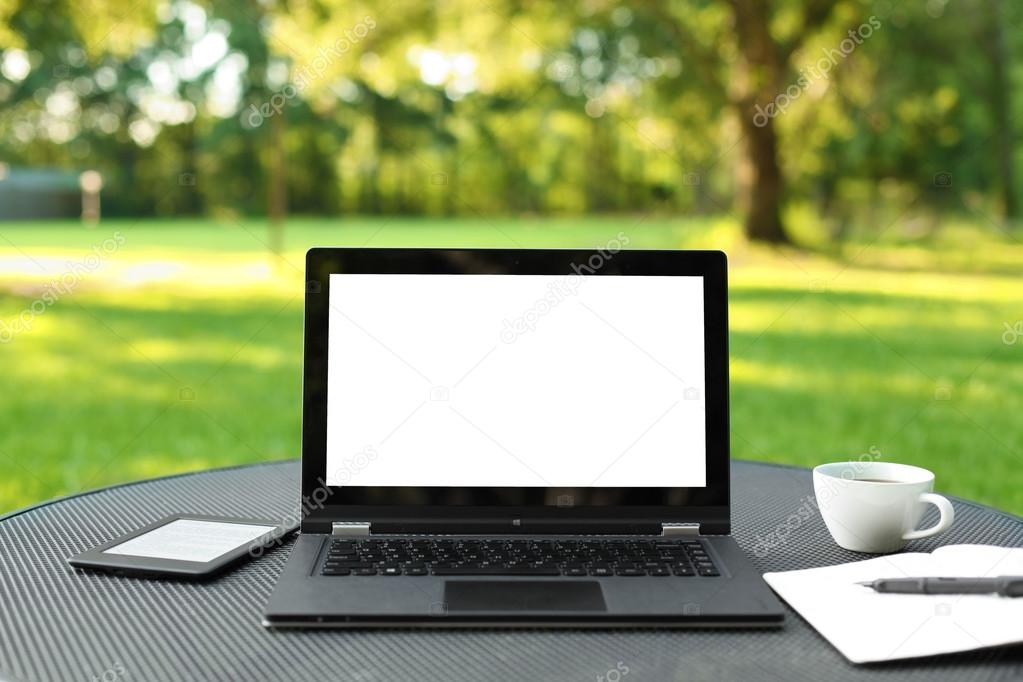 Laptop with blank screen outdoors