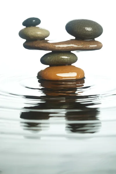 Carefully balanced stones in water — Stock Photo, Image