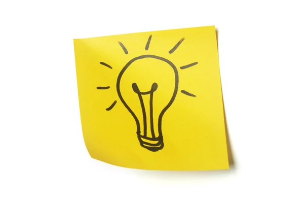 Lightbulb on sticky note — Stock Photo, Image