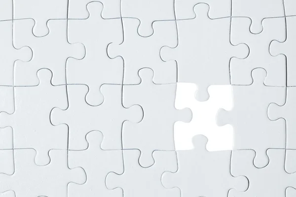 White puzzle with missing piece — Stock Photo, Image